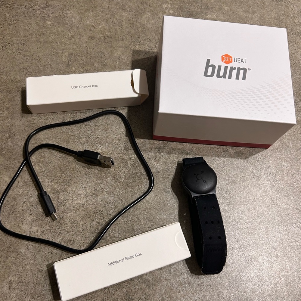 Orange Theory Beat Burn heart monitor. With an extra strap, charger, and box
